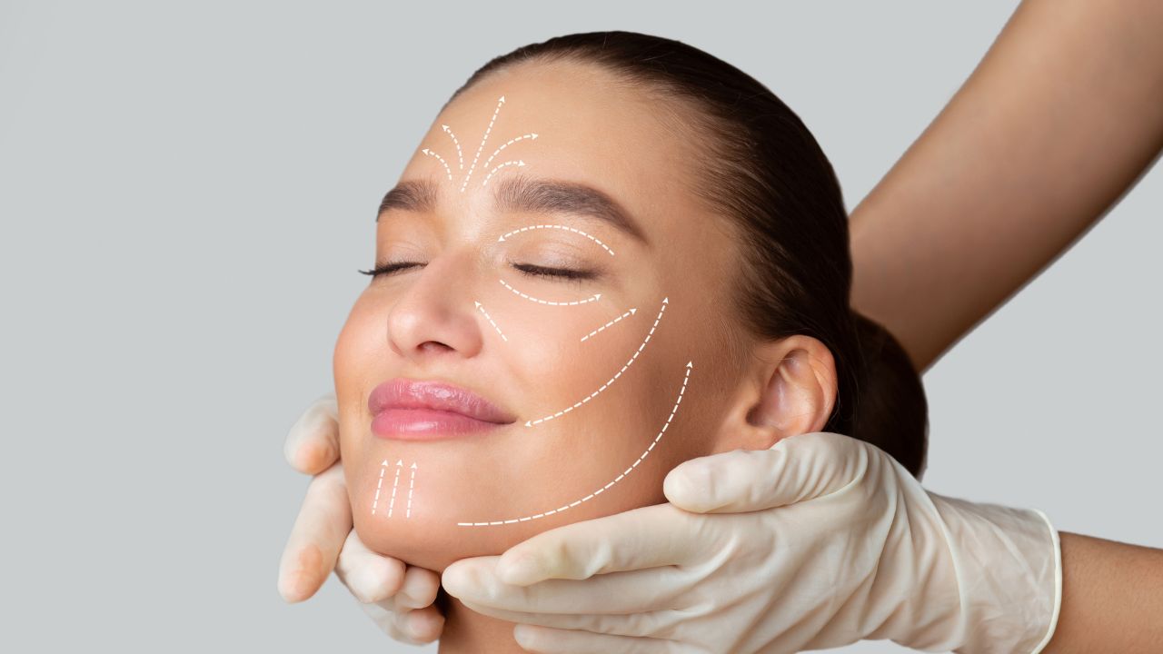 Calm girl receiving face massage Calm girl receiving face massage